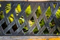 The old metal handmade back texture of the bench with blurred fe Royalty Free Stock Photo