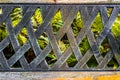 The old metal handmade back texture of the bench with ferns view Royalty Free Stock Photo