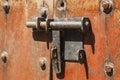 Old metal hasp on old vintage wooden door