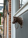 Old Metal Horse Head and Ring attached to wall of building Royalty Free Stock Photo