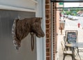 Old Metal Horse Head and Ring attached to wall of building Royalty Free Stock Photo