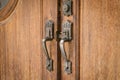 Old metal - iron, handle on a wooden door Royalty Free Stock Photo