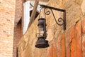 Kerosene lantern on a brick wall