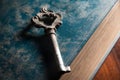 Old metal key on antique book. Royalty Free Stock Photo