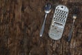 Old Metal kitchen utensils. Rusty kitchen grater, spoon, fork op