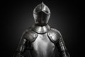 Old metal knight armour on black background