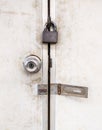 The old metal knob door and brass master key on the PVC door Royalty Free Stock Photo