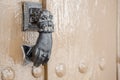 Old metal knocker on a door Royalty Free Stock Photo