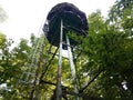 Old metal ladder and tower in forest with trees Royalty Free Stock Photo