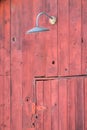 Old lamp over a barn door Royalty Free Stock Photo