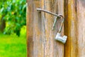 an old metal lock hanging on the doors of a barn in the garden Royalty Free Stock Photo