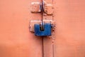 Old metal lock on pink garage door close Royalty Free Stock Photo