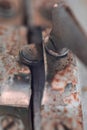 Old metal lock on a white wooden window frame. Old wooden window frame with a small rusty lock. Royalty Free Stock Photo