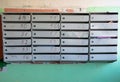 Old metal mailboxes in a residential building close up Royalty Free Stock Photo