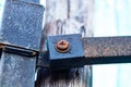 Old Metal male, female square nut rusted screw nail heads bolts, screws attached to steel plate to wood. Royalty Free Stock Photo