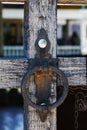 Old forged rusty handle on the wooden door of the castle Royalty Free Stock Photo