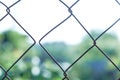 Old metal mesh with split links. Concept of separation process, moral separation Royalty Free Stock Photo