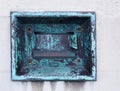 Old metal outdoor overnight deposit box also known as a night safe, once common on the outside walls of banks