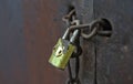 Old metal padlock on a wooden door Royalty Free Stock Photo