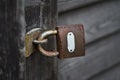 Old metal padlock on a wooden door Royalty Free Stock Photo