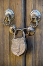Old metal padlock on a wooden door. Royalty Free Stock Photo
