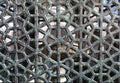 Old metal patterned lattice on a window or door, close-up Royalty Free Stock Photo