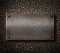 Old metal plate over rusty background Royalty Free Stock Photo