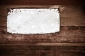 Old metal plate on wooden wall Royalty Free Stock Photo