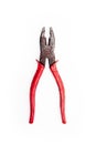 Old metal pliers with red handles