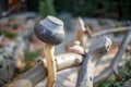 Old metal pot on a wooden fence. Rural scenery. Traditional old Slovenian Ukrainian pot on a wattled fence.