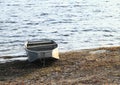 Punt anchored on bank of lake