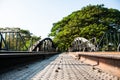 The Old Metal Railway Bridge that leading to tree tunnel. Royalty Free Stock Photo