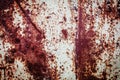 Old metal rusted wall partly covered with peeling paint. Grunge texture and background. Close-up Royalty Free Stock Photo