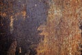 Old metal rusted wall partly covered with peeling paint. Grunge texture and background. Close-up Royalty Free Stock Photo