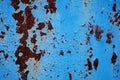 Old metal rusted wall partly covered with peeling paint. Grunge texture and background. Close-up Royalty Free Stock Photo