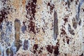 Old metal rusted wall partly covered with peeling paint. Grunge texture and background. Close-up Royalty Free Stock Photo