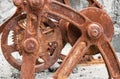 Old metal rusty mechanism with frame, wheels and gears