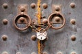 Old metal rusty medieval door locked with a chain and padlock Royalty Free Stock Photo