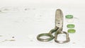 Old metal scissors, buttons on the old painted surface Royalty Free Stock Photo