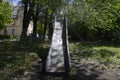 Old metal slide for children riding. Royalty Free Stock Photo