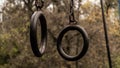 Old metal sports rings on chains close-up, outdoor gym