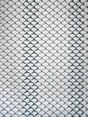 Old metal steel springy mesh with chain link on a beige background