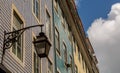 The old, metal, street lamps mounted on colorful tiled buildings in Lisbon, Portugal Royalty Free Stock Photo
