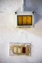 Old metal switchs against a white plaster wall Royalty Free Stock Photo