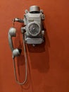 Old metal wall mounted rotary dial telephone Royalty Free Stock Photo