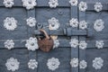 The old metal wrought-iron door is locked with a padlock. Closed metal lock.