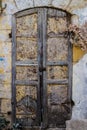 Old metal yellow door with pusty and wood a beautiful vintage background