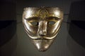 Old metallic Arabic mask close up