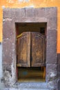 Mexican Battered Wooden Saloon Style Door with Cracked Wall