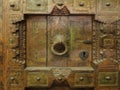 Old Mexican carved wood panel with hammered metal handle Royalty Free Stock Photo